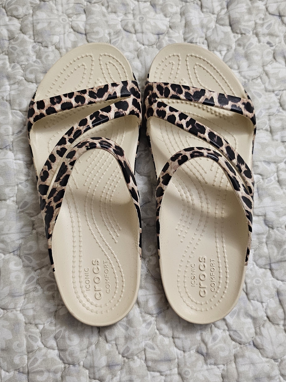 Crocs Women’s Leopard Print Slip-On Sandals in Cream